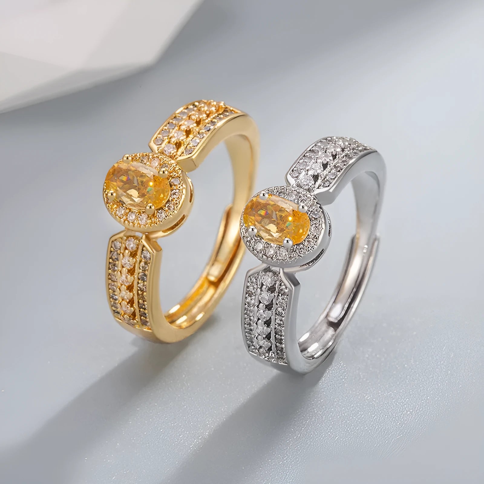Champagne gold copper ring with open adjustable design and diamond setting against a white background