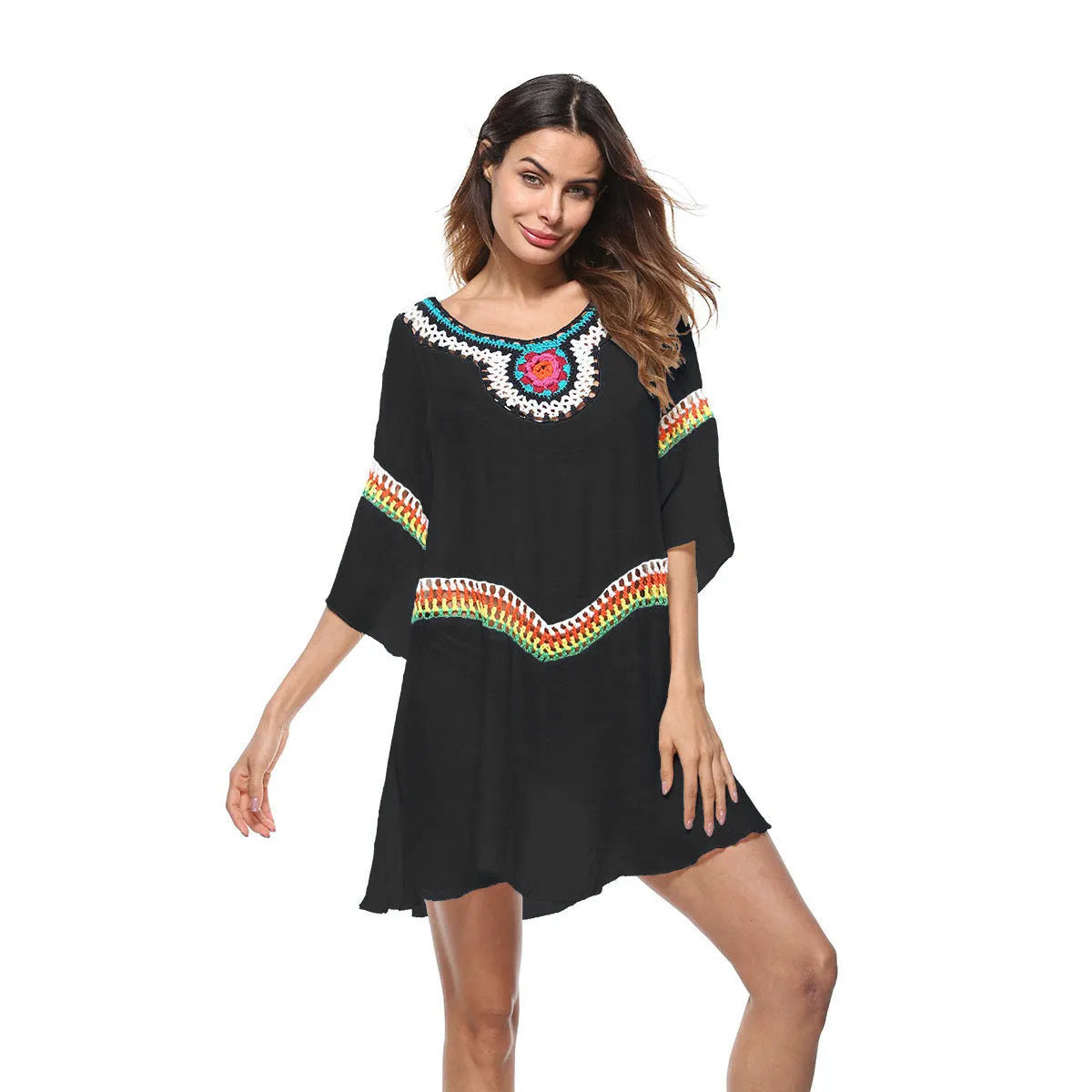 Women's crocheted white beach cover-up top for sun protection during swimming.