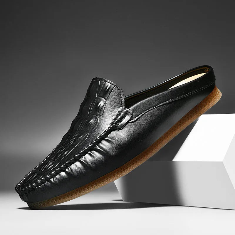 Men's black breathable semi-slippers with an artificial PU upper and rubber sole, shown from the side.