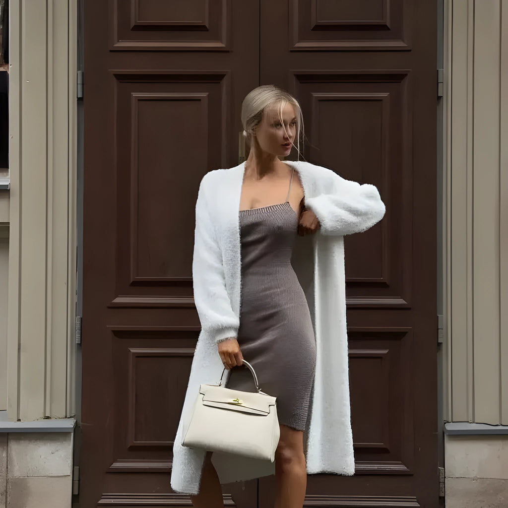 White women's longline cardigan sweater with loose fit and long sleeves.
