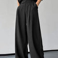 Black men's trousers with vertical stripes, front pleats, and a soft rabbit hair bamboo fibre fabric blend.