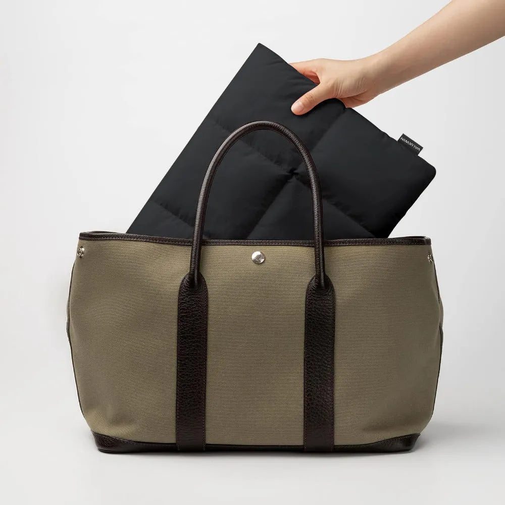 Soft black laptop sleeve for 13-15.6 inch computers with visible stitching and polyester construction