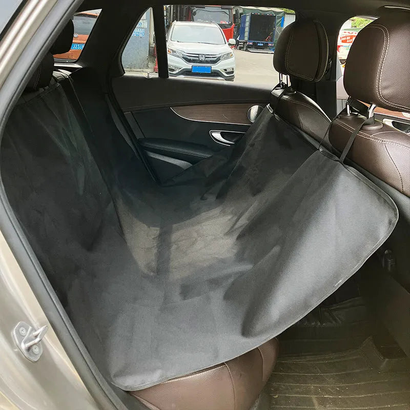 Cloth car pet mat for rear seat protection, shown in a dog bone print design on a grey background.