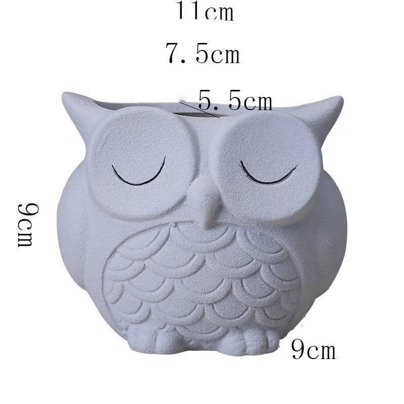 Handmade frosted ceramic flower pot with a cartoon owl design for small succulents.