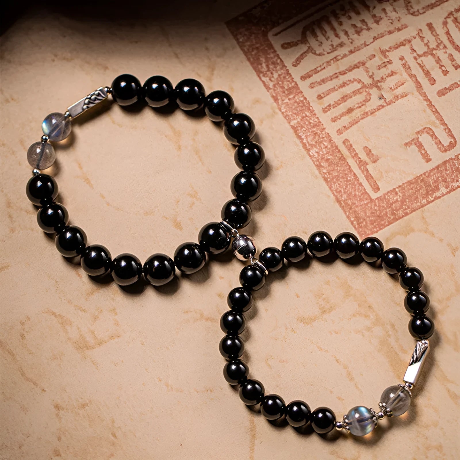 Obsidian Buddha beads couple bracelet DIY set showing 10mm and 8mm bead sizes in national style design