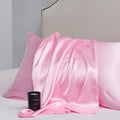 A pair of solid colour satin pillowcases in a chosen shade, shown flat to display size and plain weave texture.