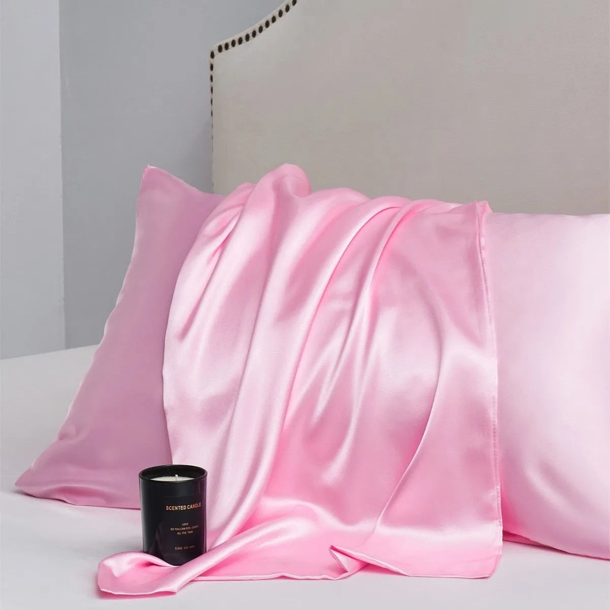 A pair of solid colour satin pillowcases in a chosen shade, shown flat to display size and plain weave texture.