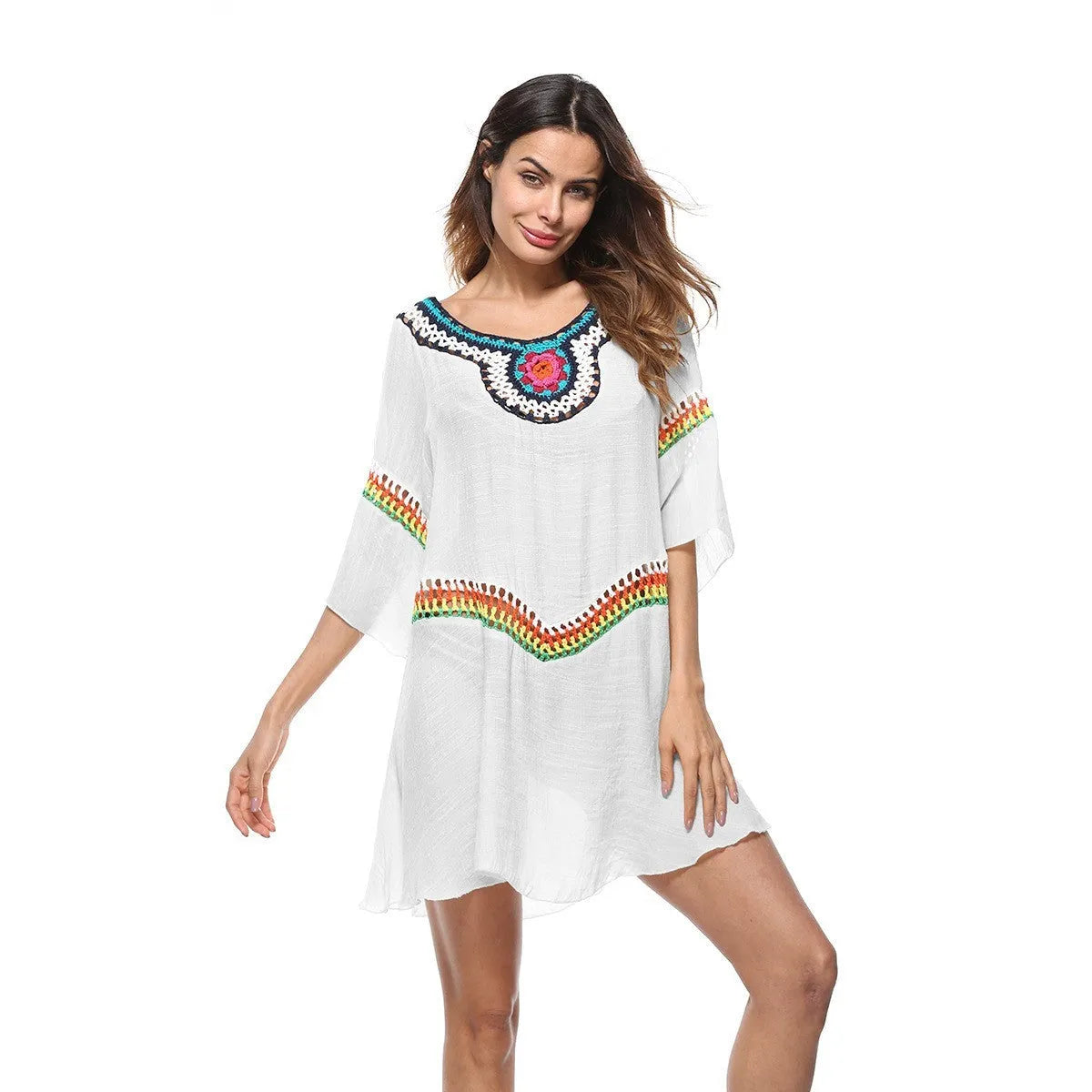 Women's crocheted white beach cover-up top for sun protection during swimming.