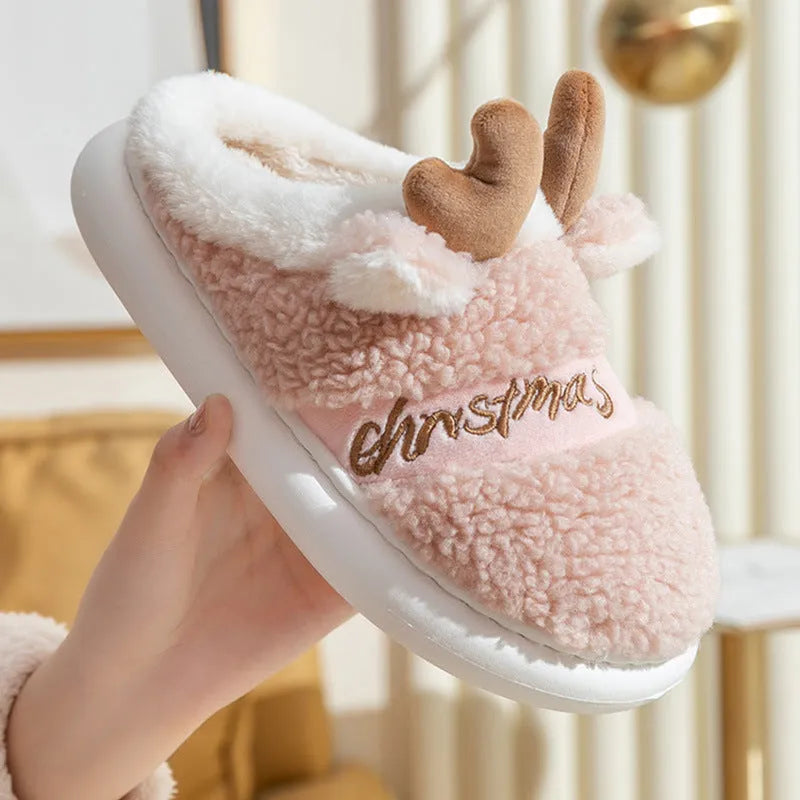 Christmas winter home slippers with suede upper and EVA sole in antler pink colour