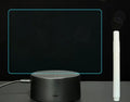 Black 3D acrylic LED message board night light with remote control and pen on desk