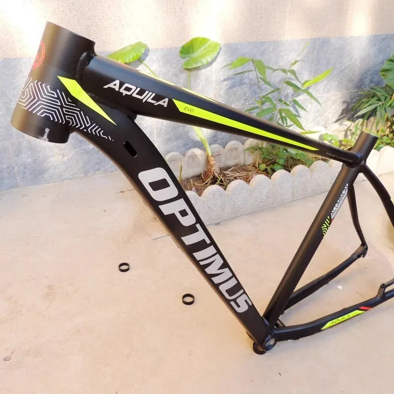 Black green 29-inch aluminium mountain bike frame showing internal cable ports and disc brake mounts