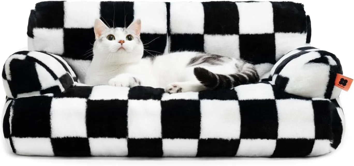Fluffy cat couch bed in black and white with raised sides and non-slip base for cats and small dogs