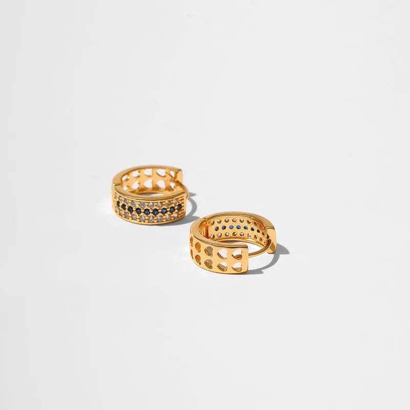 Geometric round women's post earrings with a gold electroplated finish on a copper base.
