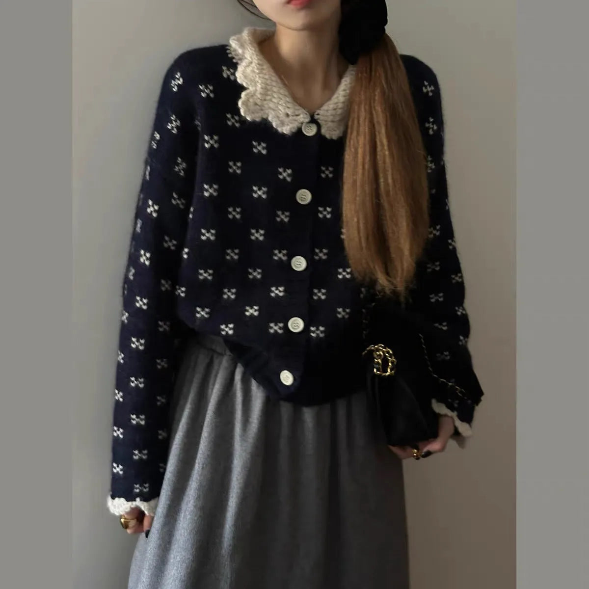 Women's floral knit cardigan coat with Peter Pan collar and button front in navy blue