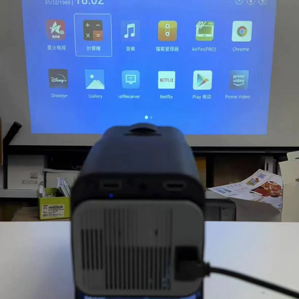 HD wireless home projector with carrying handle for gaming and cinema projection