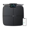 Black eight-electrode body fat and weight scale on a bathroom floor