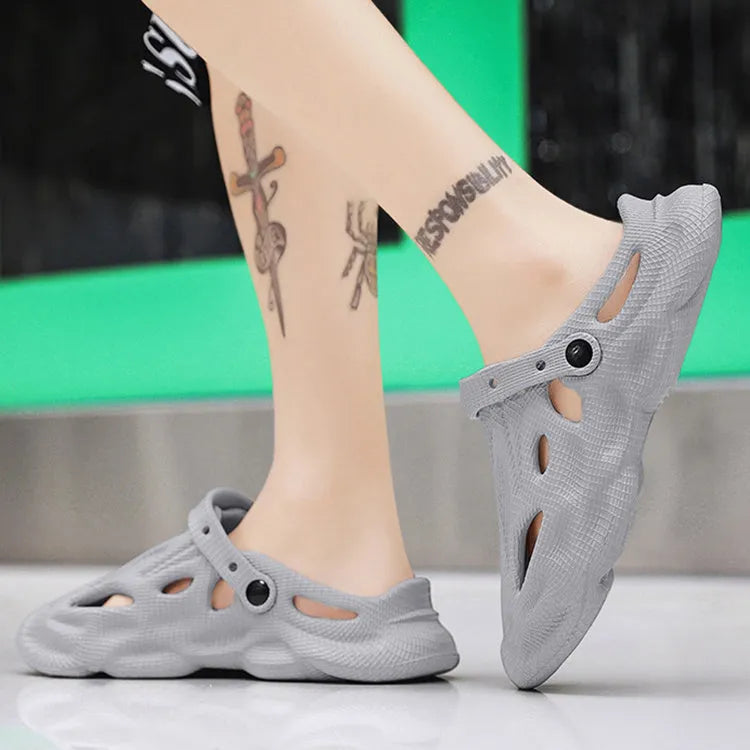 EVA soft men's summer beach shoes in grey colour on sandy surface