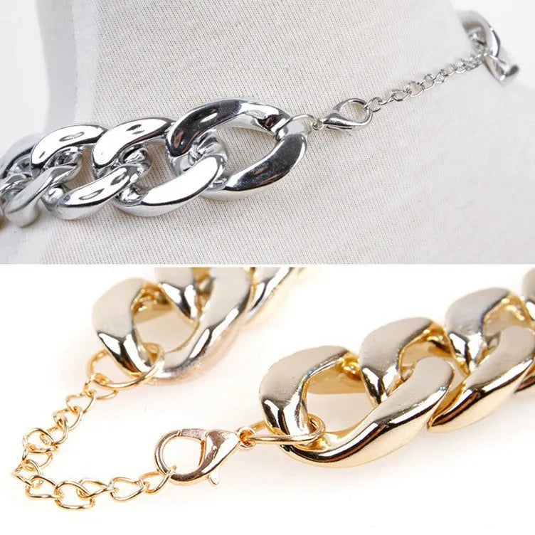 Gold coloured chain dog collar with twisted geometric pattern and buckle on small dog