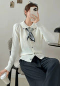 Women's milky white cardigan sweater with a built-in lapel scarf collar and long sleeves.
