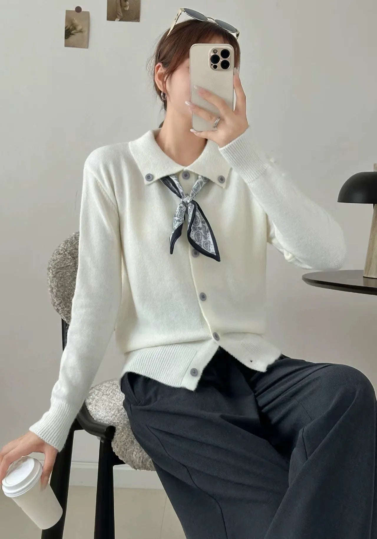 Women's milky white cardigan sweater with a built-in lapel scarf collar and long sleeves.