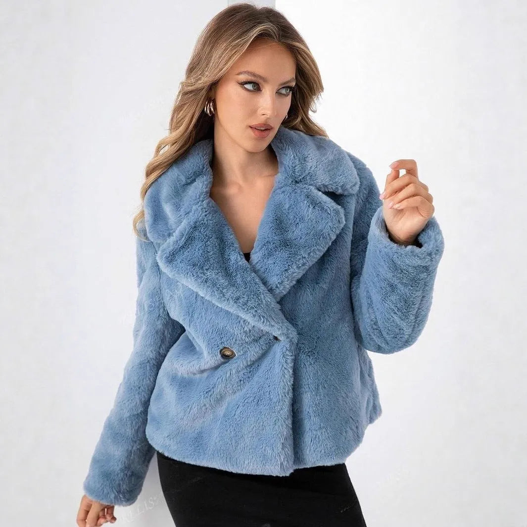 Women's artificial fur coat in rose red colour with regular sleeves on a hanger.