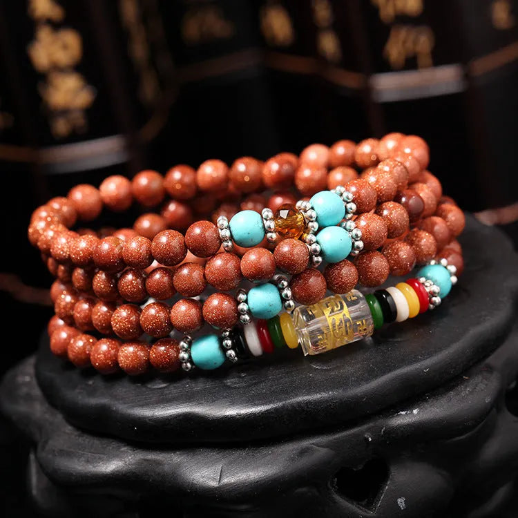 Golden Star Stone women's bracelet with 108 nugget sand pieces and fu character mantra beads