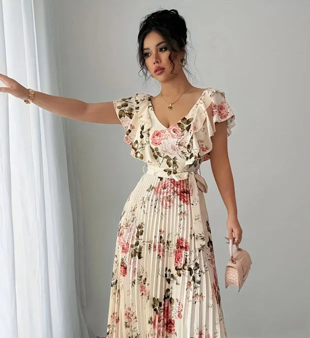 Apricot colour dress with digital floral print, V-neck, ruffled short sleeves, and a high-waisted oversized swing skirt.