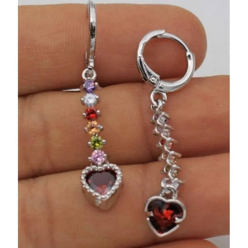 A pair of women's heart-shaped alloy earrings in a gold or silver electroplated colour.