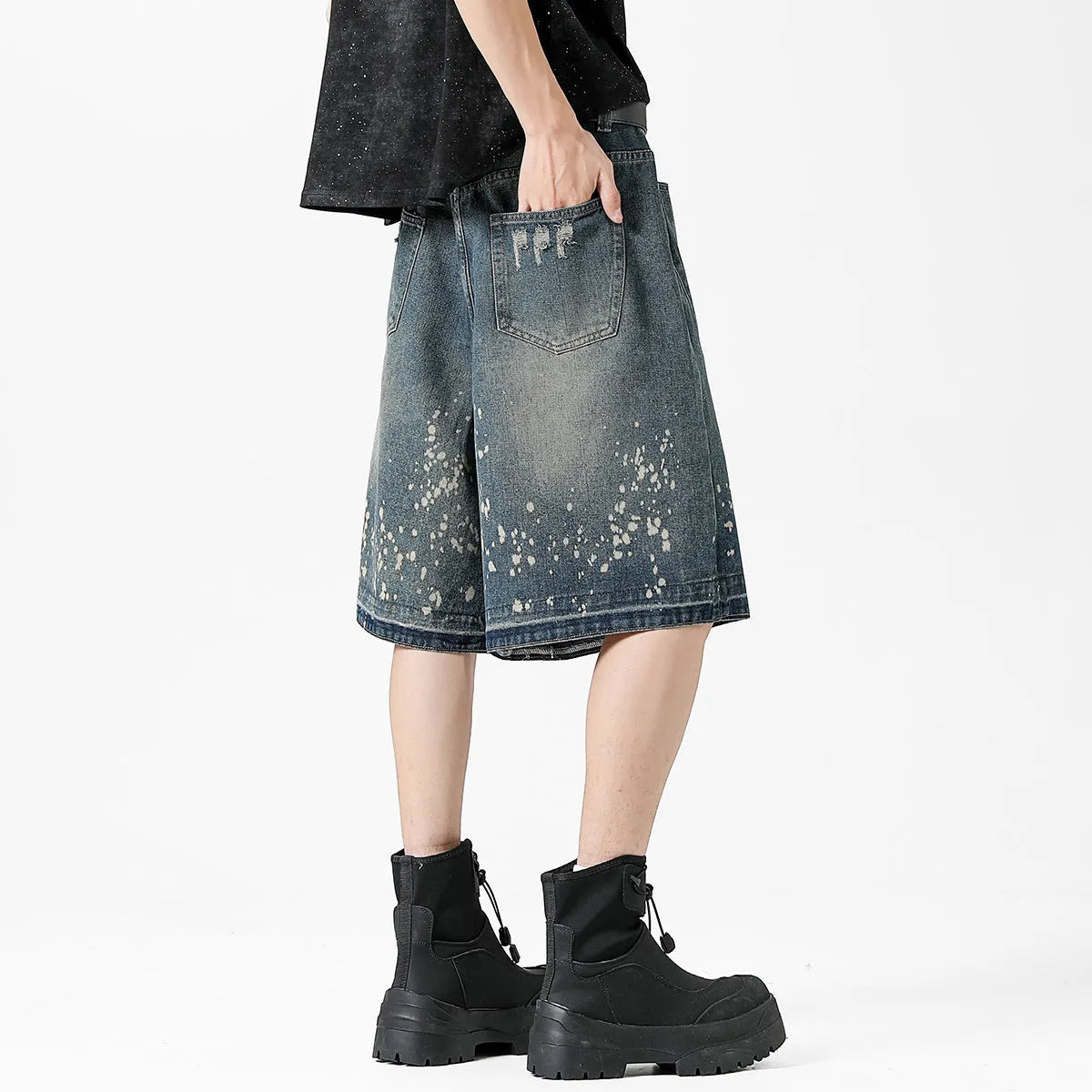 Men's retro blue denim shorts with splash ink distressing and straight-leg cut