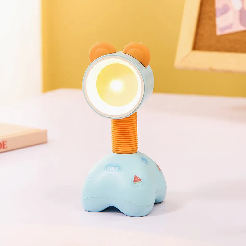 DIY cartoon animal small night lamp with magnetic base in assorted colours on a desk.