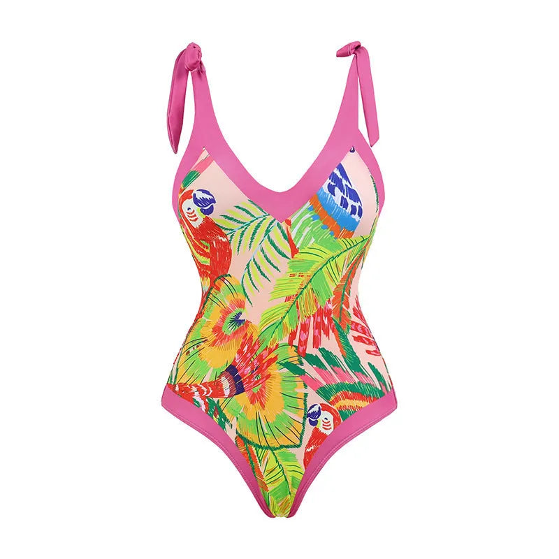 Pink floral print women's V-neck one-piece swimsuit with an attached skirt cover