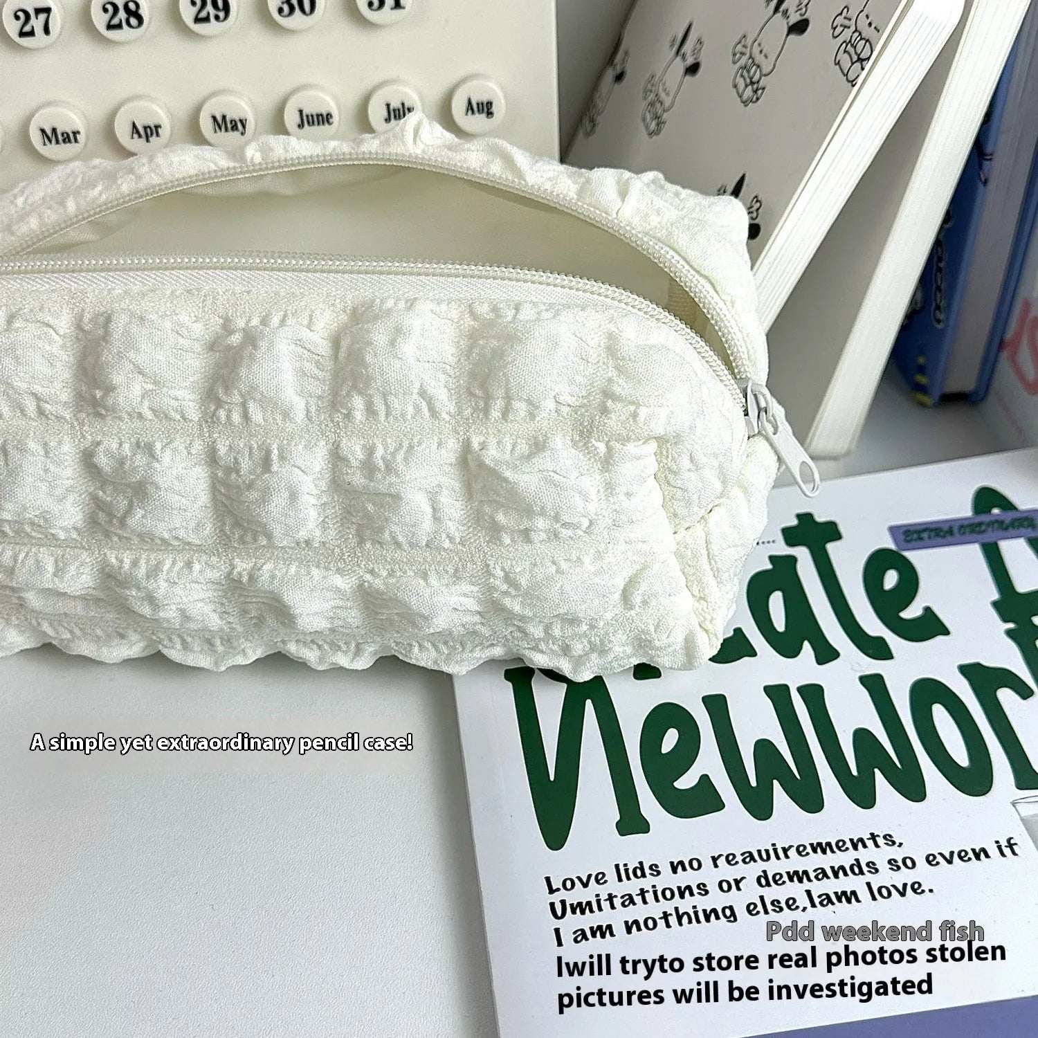 Beige fabric pencil case with a cream puff textured design for holding pens and pencils.