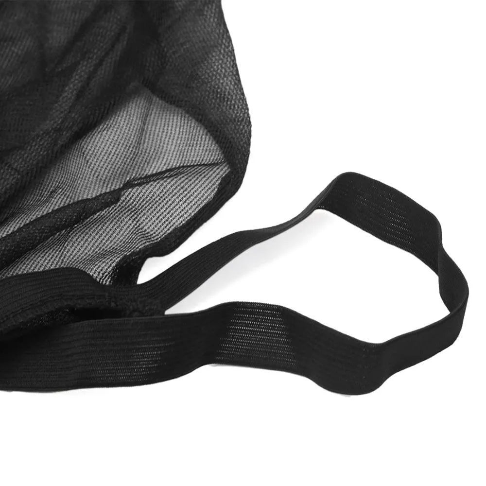 Set of grey non-woven fabric car side window sunshades with elastic edges on a car window.