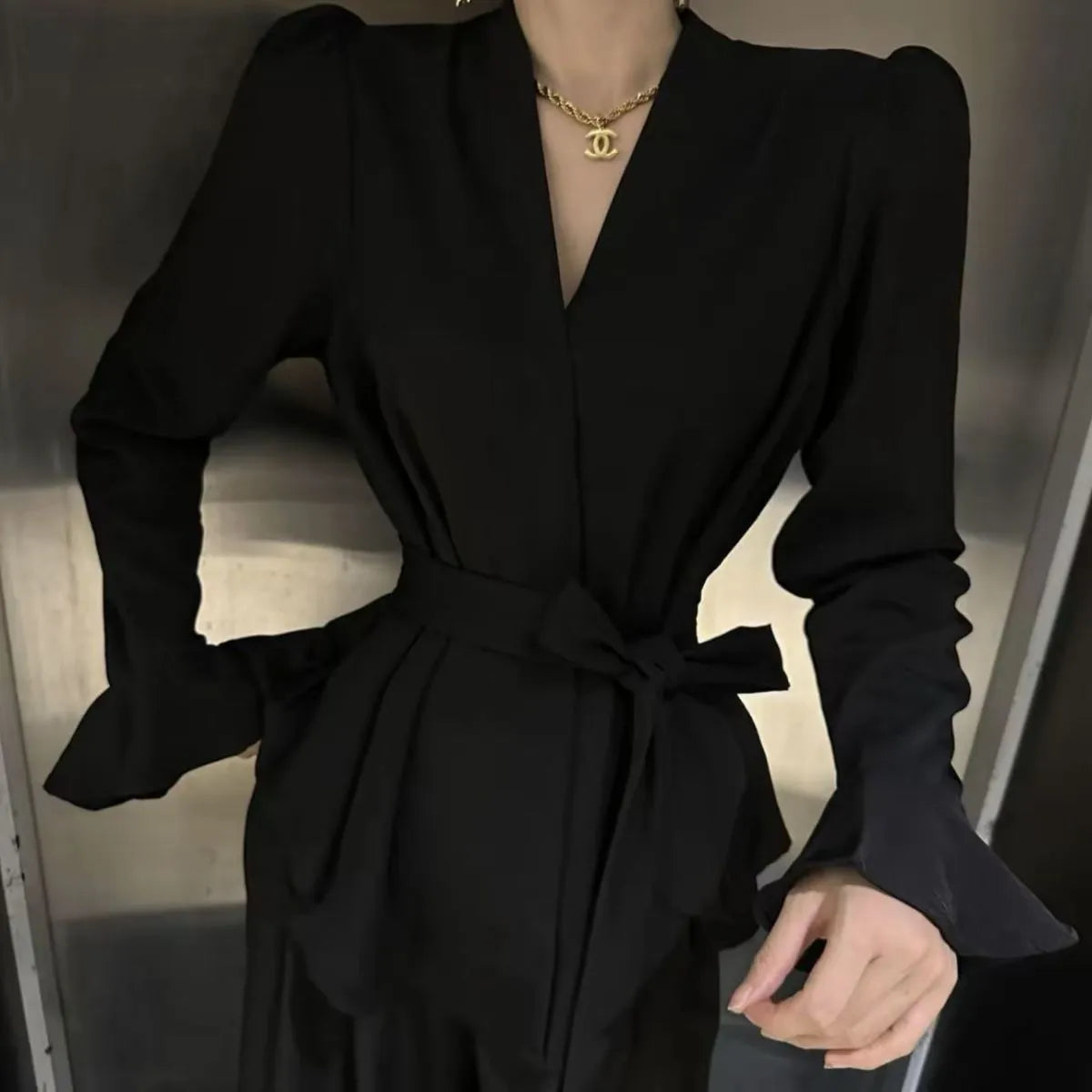 Women's French-style irregular collar tied shirt with bell sleeves in a choice of colours.