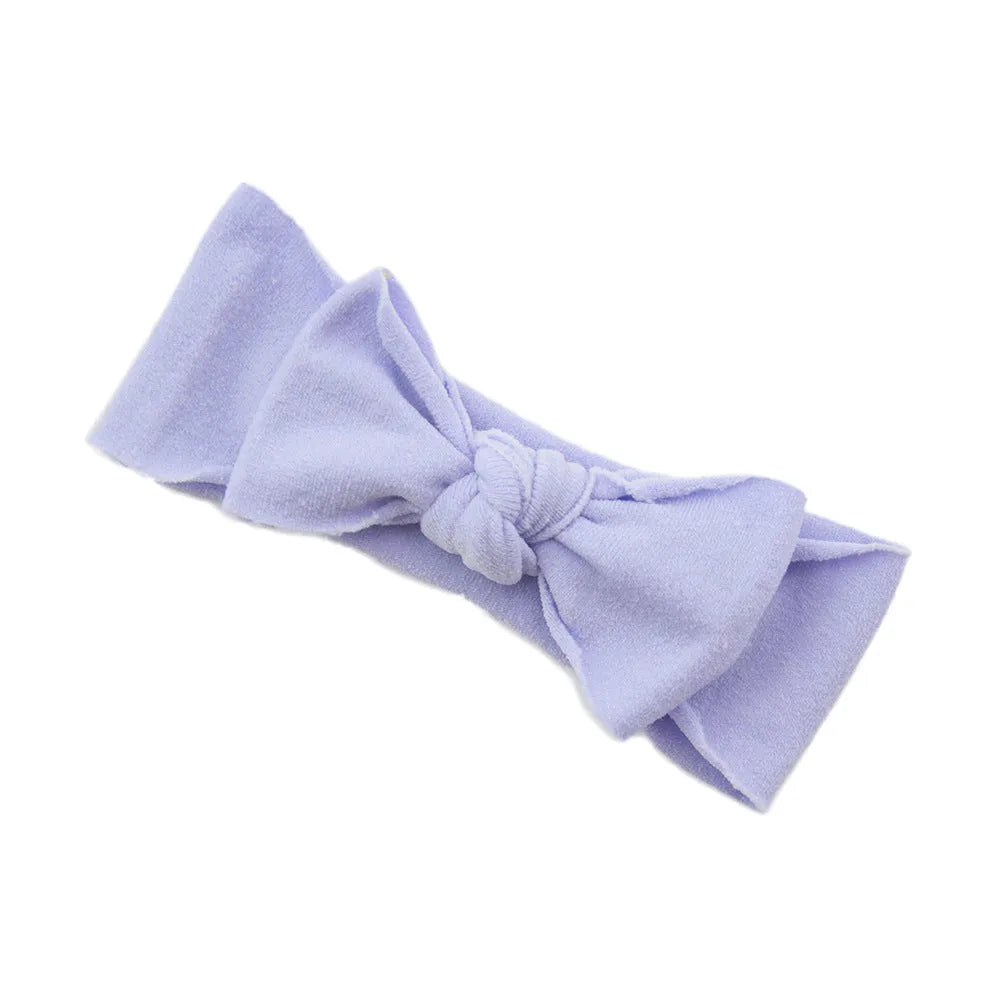 Solid colour knotted cloth headband for baby girls with bowknot design, available in 37 colours