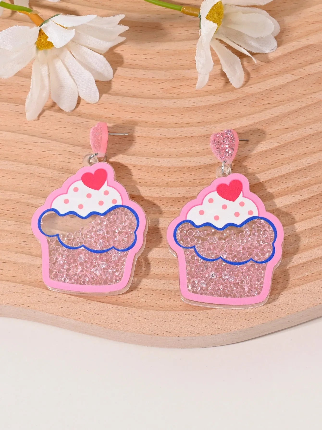 Colourful acrylic earrings with fruit and dessert designs including cherry, strawberry and watermelon shapes