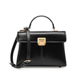 Women's black leather shoulder bag with vachette clasp, showing horizontal square shape and adjustable strap