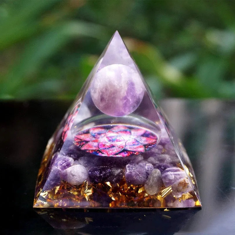 Clear resin pyramid ornament with embedded crystal gravel pieces, 6cm tall with hanging cord.