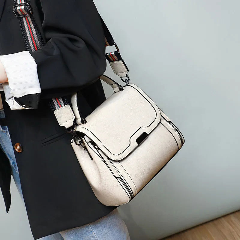 Women's retro style genuine leather messenger bag in horizontal square shape with multiple internal compartments