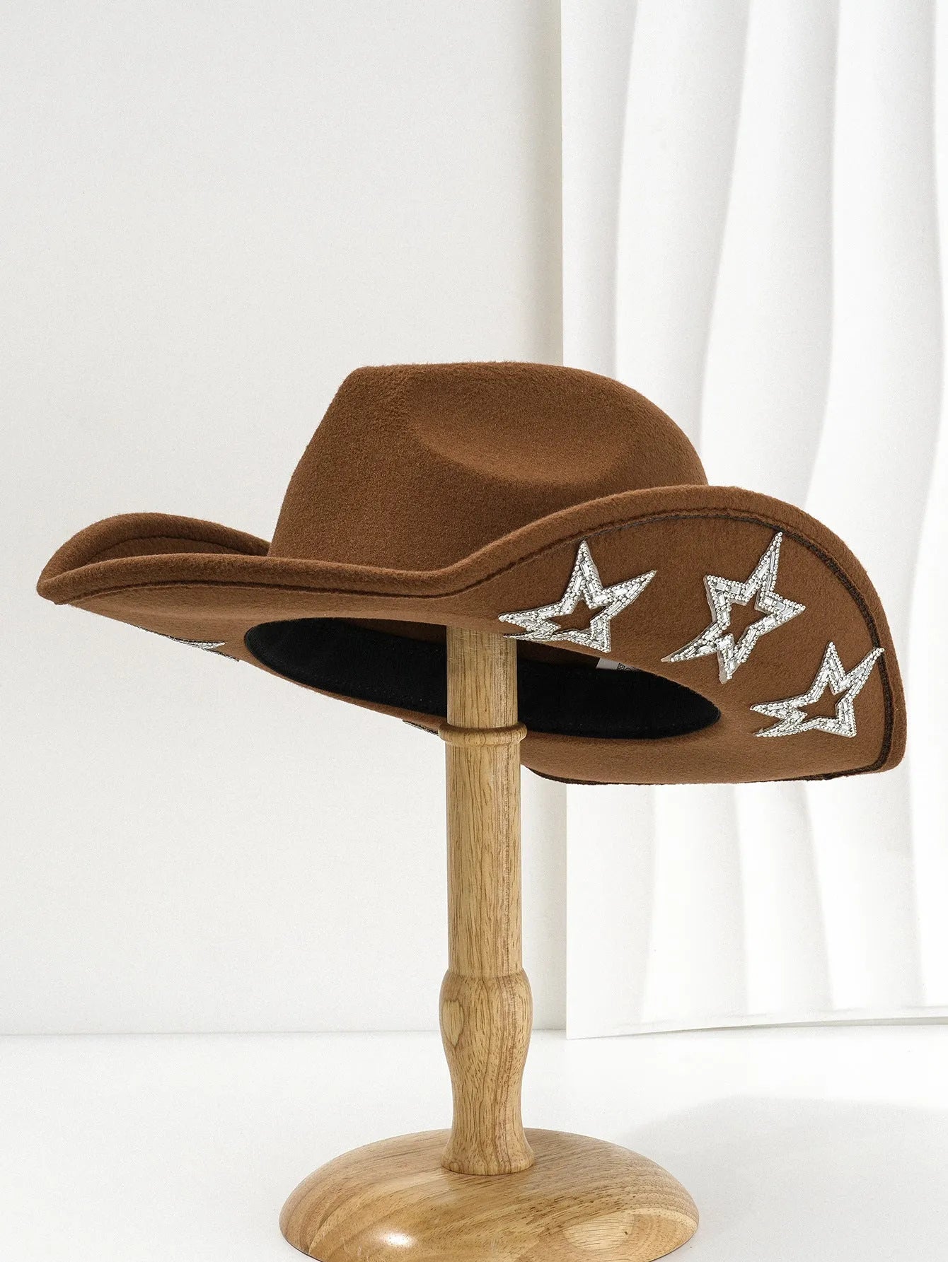 Beige polyester western denim top hat with a conical crown and a silver hexagonal star decoration on the front.