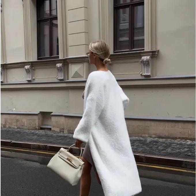 White women's longline cardigan sweater with loose fit and long sleeves.