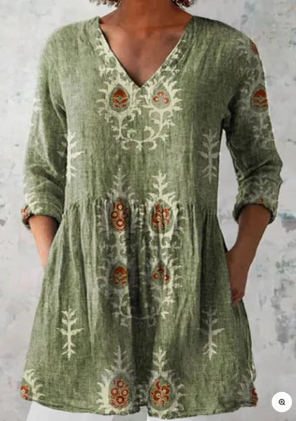 Women's printed wave pattern loose dress with wide waist and 3/4 length sleeves.