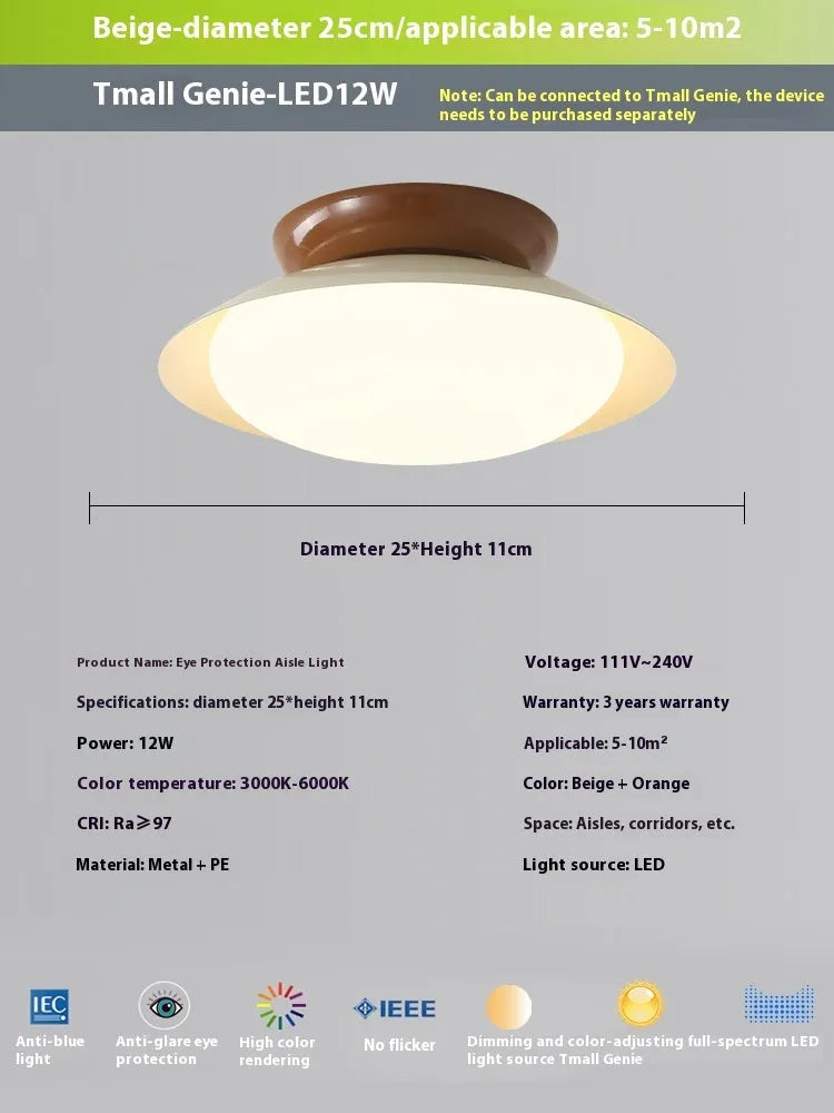 Modern minimalist cream style flying saucer ceiling lamp in mint green on a white ceiling.