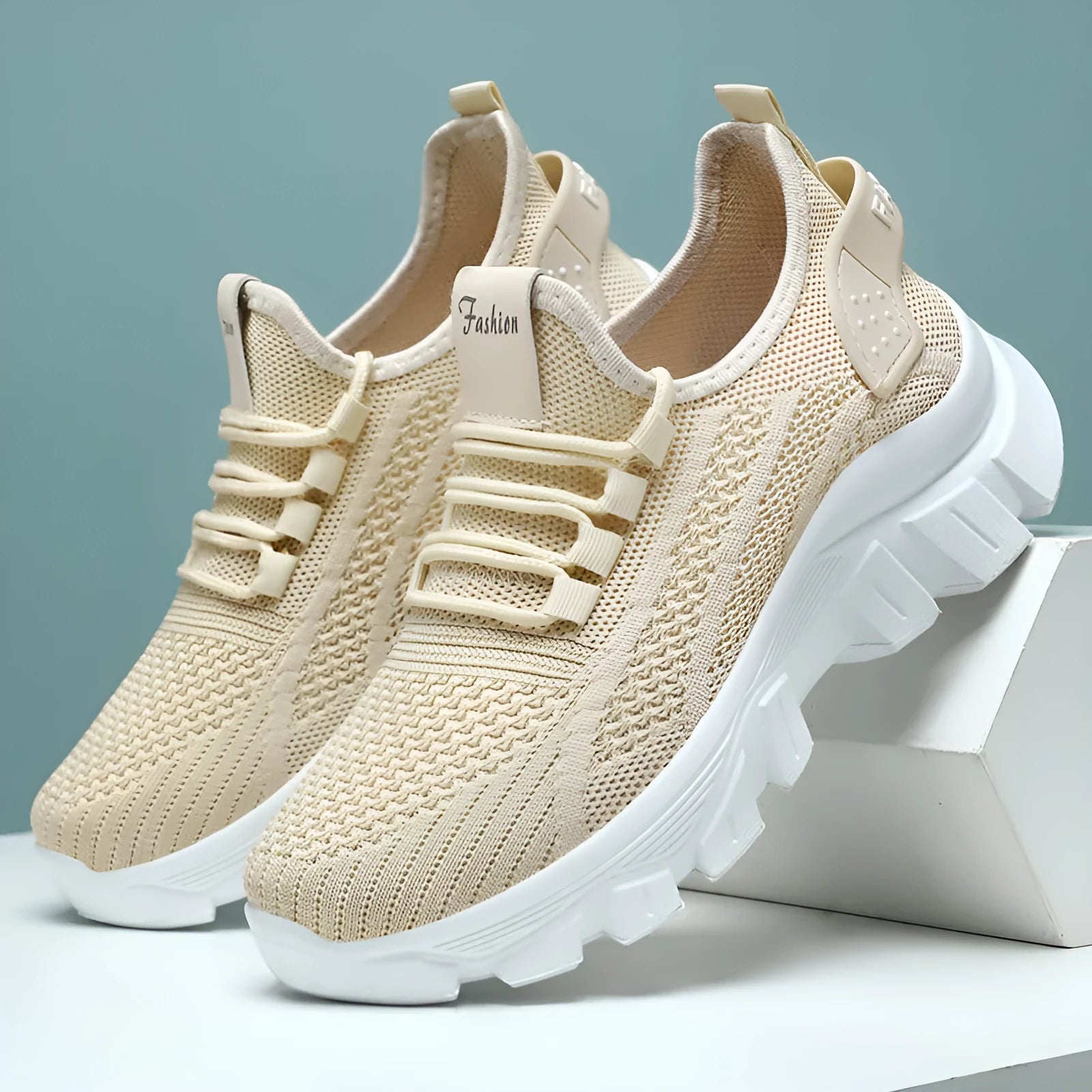 Women's white Flyknit sneakers with round toe and flat heel on a thick PVC sole.