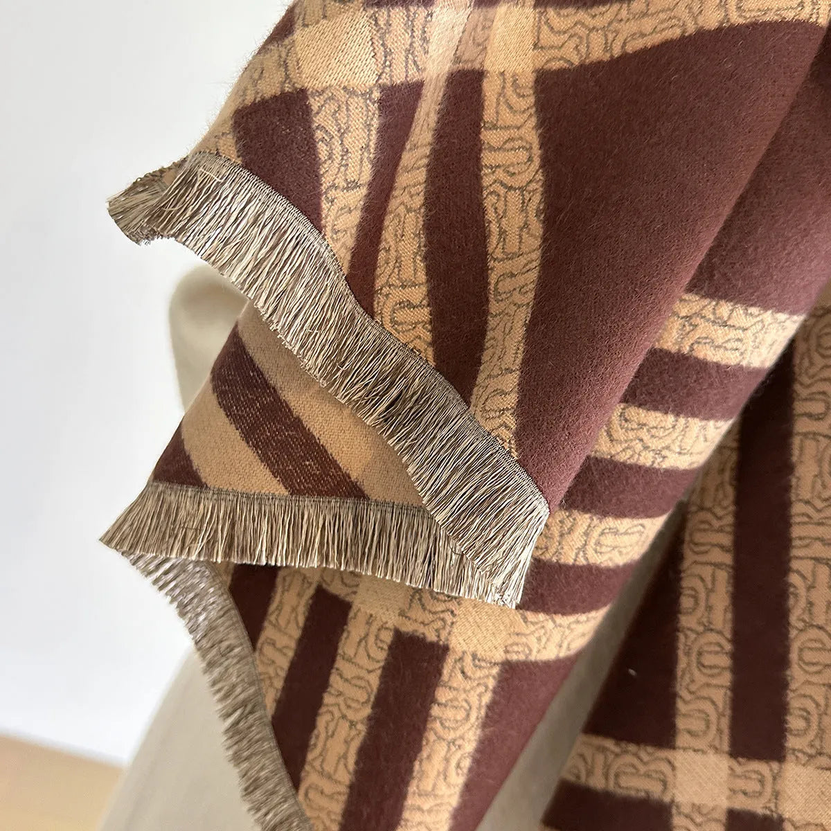 Mid-length cashmere-like scarf with tassels in brown colour showing 185cm length