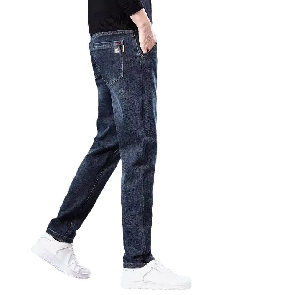 Blue gray slim straight casual men's trousers on a hanger, showing mid-waist fit and zipper fly.