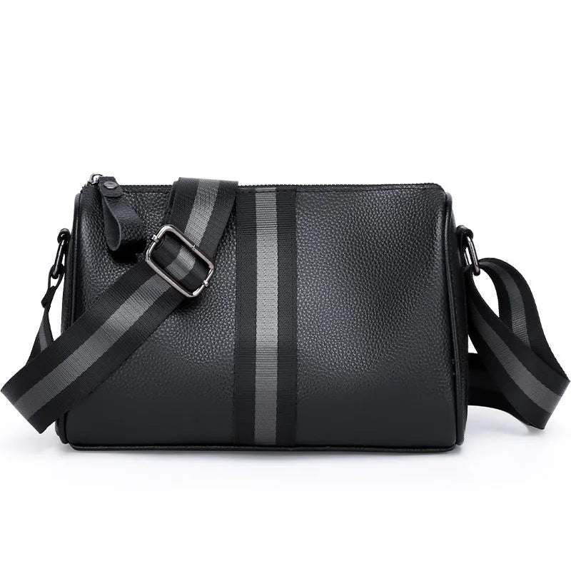 Black genuine leather crossbody bag with one-shoulder strap showing interior polyester lining