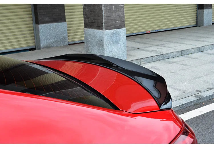 Large bright black fixed wing tail trim spoiler for a Mazda 3 Axela Exela