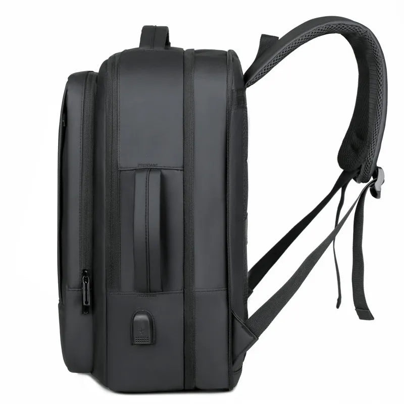 Black Oxford cloth waterproof backpack with curved shoulder strap, shown with a laptop compartment open.