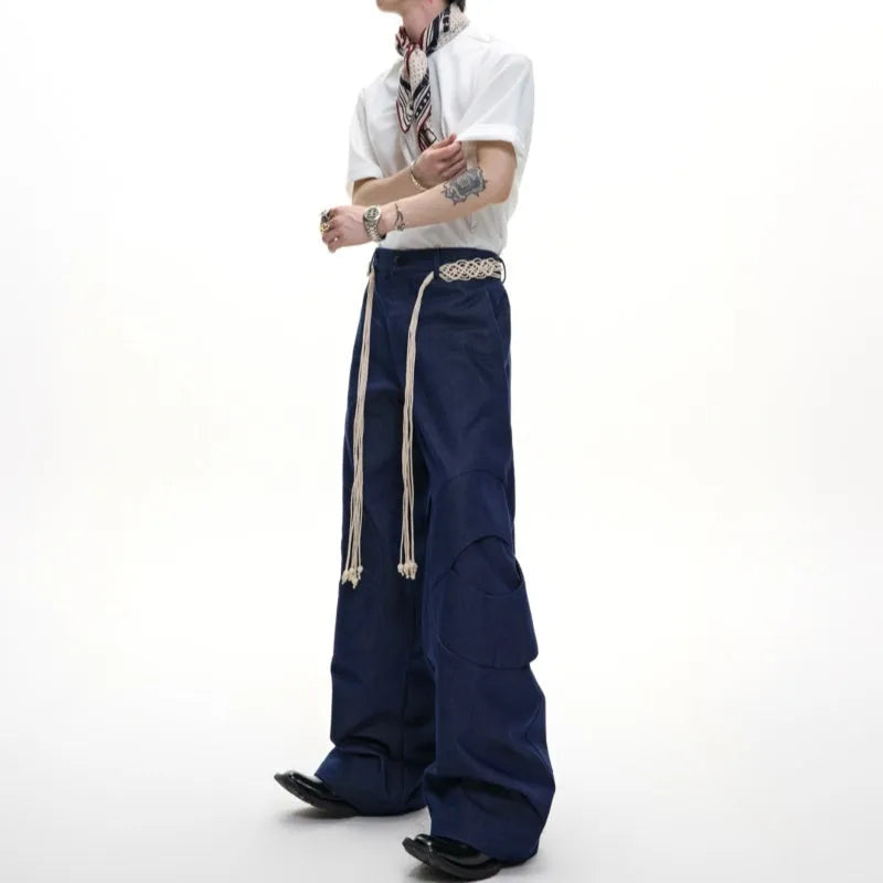 Men's dark wash straight-leg jeans with 3D cutting, zip decorations, and tassel details
